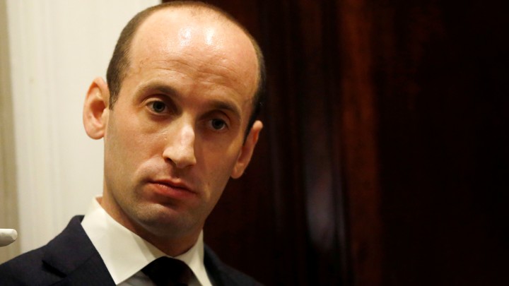 White House policy advisor Stephen Miller listens as U.S. President Donald Trump holds a round table meeting with members of law enforcement about sanctuary cities in the Roosevelt Room at the White House in Washington